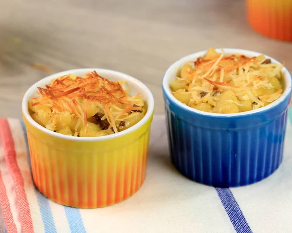Baked Macaroni Schotel (Macaroni and Cheese) on Yellow and Blue Ramequin. Easy Snack for Kids