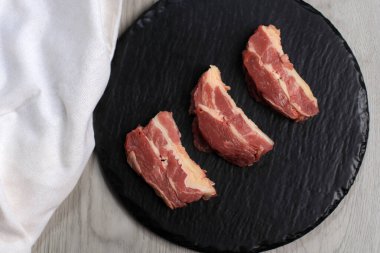 Raw Beef Ribs on Stone Plate