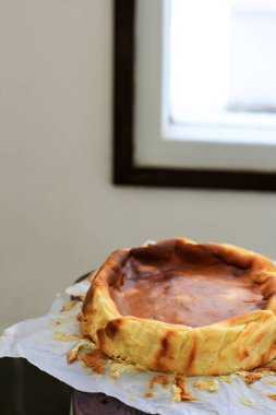 Selected Focus Basque Burnt Cheese Cake on White Kitchen Background, Viral Cheese Cake