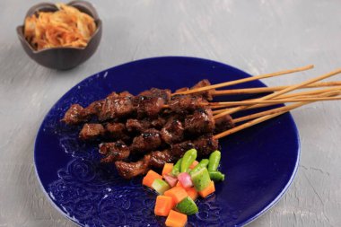 Selected Focus Homemade Indonesian Lamb Satay (Sate Kambing) is Popular Menu for Idul Adha (Eid al Adha).
