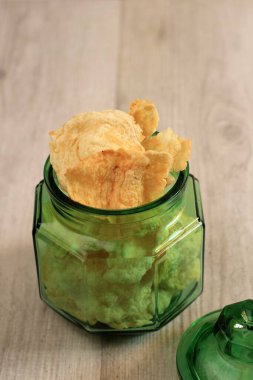 Emping Melinjo is Indonesian Traditional Crackers in a Green Jar, made from Melinjo or Belinjo (Gnetum gnemon) Nut