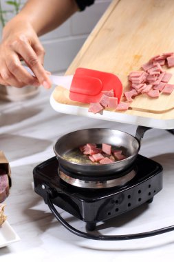 Cooking Process CUt Diced Salami (Thin Slice Smooked Beef) with Butter in the Kitchen 