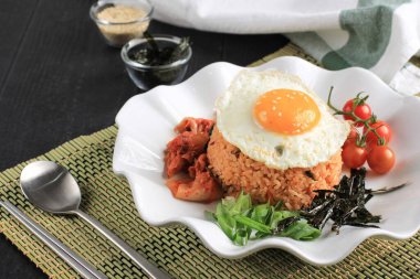 Kimchi Fried Rice with Seaweed, Sunny Side Egg, and White Sesame - Korean Food Style