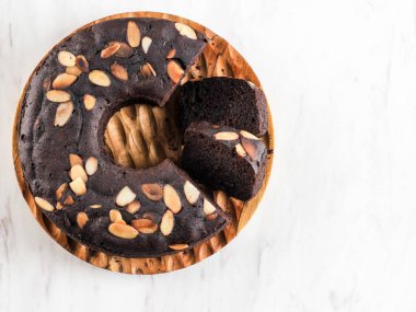 Chocolate Brownies Decorated with Almond Slice on Dark Background, Copy Space on White Background 