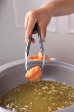 Frying Odading (Kue Bantal), Indonesian Viral Street Food, Made from Flour, Yeast, and Sugar. 