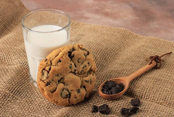 American Chocolate Chips Cookies, Soft Cookies  Served with A Glass of Fresh Milk  on Brown background
