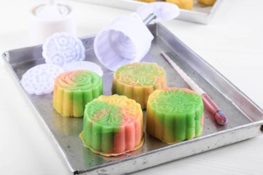 Colorful Snow Skin Moon Cake, Sweet Snowy Mooncake, Traditional Savory Dessert for Mid-Autumn Festival on Pink Background, Close up, Lifestyle