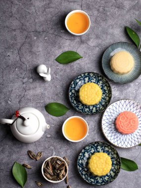 Colorful Snow Skin Moon Cake, Sweet Snowy Mooncake, Traditional Savory Dessert for Mid-Autumn Festival on Pink Background, Close up, Lifestyle