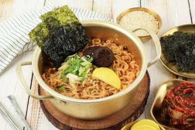 Korean Style Instant Noodle, Ramyeon with Mushroom, Green Onion, Danmuji, and Nori Topping