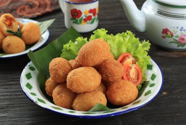 Comro or Combro, Onjom di Jero. Grated Caasava with Spicy Fermented Peanuts, Traditional Sundanese Fritters