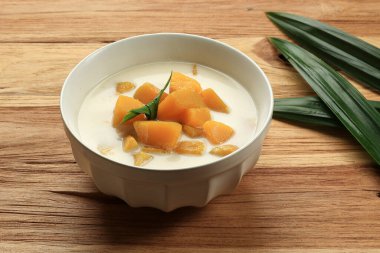 Kolak Waluh or Kolek Labu Kuning, Indonesian Traditional Dessert Made from Pumpkin with Coconut Milk and Sugar