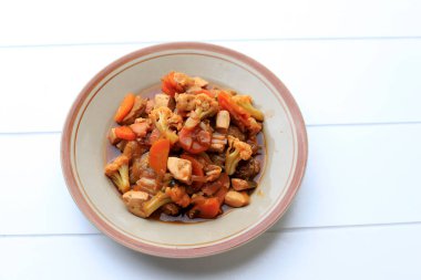 Capcay Merah Surabaya, West Java Typically Chinese Food, Stir Fry Vegetable, Chicken or Seafood, and Egg with Red Thick Sauce 