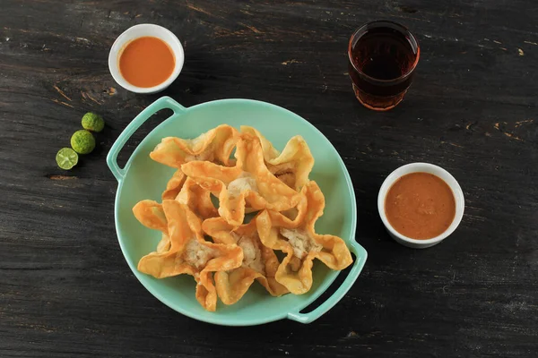 stock image Baso Tahu Goreng or Batagor, Bandung Popular Street Food Snack, Made from Tapioca Flour and Fish Batter on Dumpling SKin. Deep Fried, Served with Peanut Sauce