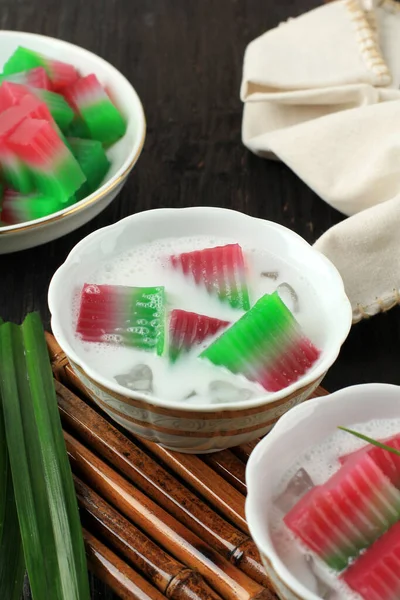 Es Selendang Mayang, Betawi Dessert Drink of Tri Color Mungbean Jelly Cake in Coconut Milk and Sugar Syrup.