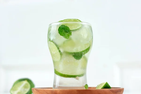 Iced Lime Soda with Mint Leaf on White Background. Summer Refreshing Drink Comcept