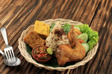 Nasi Tutug Oncom, Traditional Sundanese Meal Rice Mixed with Oncom Fermented Soybean Products, Served with Sambal and Fried Chicken clipart