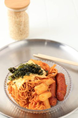 Rabokki, Topokki with Ramyeon Noodles, Sausage, and Sausage. Topping with Melted Cheese and Nori clipart