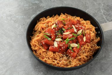 Rabokki or Ramen Tteokbokki, Korean Instant Noodle with Rice Cake Tteokpokki in Spicy Gochujang Korean Sauce clipart