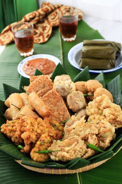 Aneka Gorengan Tampah, Various Indonesian Fritter, usually Eat for Snack and Breakfast with Lontong. Popular for Break The Fasting Takjil Buka Puasa. clipart