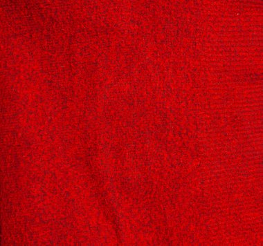 Kırmızı örülmüş yün Noel arkaplanı. Sıcak süveter atmosferi. Noel duvar kâğıdı. Yün ya da akrilik formanın dokusu. Kış tasarımı için temel