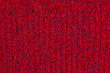 Kırmızı örülmüş yün Noel arkaplanı. Sıcak süveter atmosferi. Noel duvar kâğıdı. Yün ya da akrilik formanın dokusu. Kış tasarımı için temel