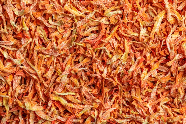 Organic Dehydrated Carrots. Freeze Dried Carrot Pieces. Air Dried Vegetables Dehydrated Carrot Slice Flakes Granules. Carrot background.