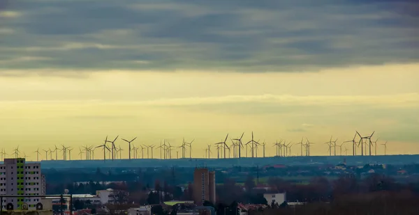 Wind farm or wind farm at sunset in cloudy weather in Austria in Europe, allows you to get clean energy. It\'s sustainable, renewable energy for the environment