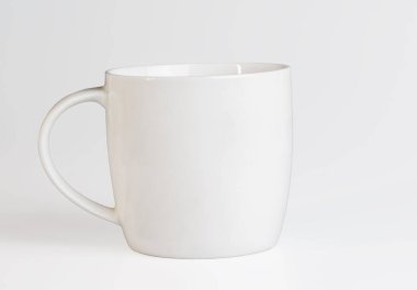 White cup on a white background. Side view. Mockup template