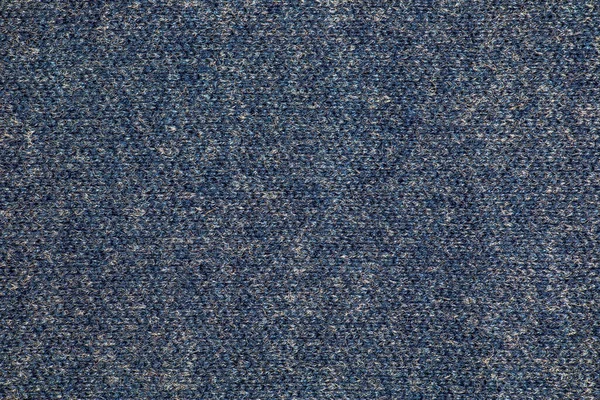 Texture of blue knitted fabric. Abstract modern knitted texture in blue color. Dark knitted background