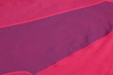 Sentetik kumaş dokusu, kırmızı ekose, güzel arka plan deseni. Termal iç çamaşırı parçası..