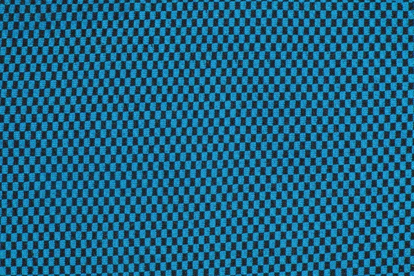Synthetic fabric texture, blue plaid, beautiful background pattern. Fragment of thermal underwear fabric.