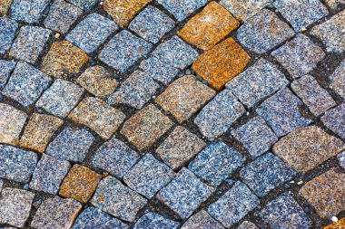 Taş kaldırımın arka planı. Taş bloklardan yapılmış asfalt..