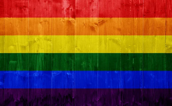 Tahtaların Ahşap Dokusunun Arka Planında Lgbt Topluluğunun Bayrağı Gökkuşağı Eşcinsel — Stok fotoğraf