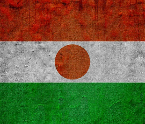 ニジェール共和国の国旗は テクスチャーされた背景にあります コンセプトコラージュ — ストック写真