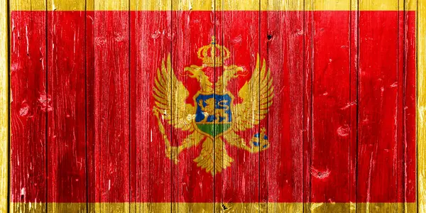 モンテネグロの国旗は テクスチャされた背景にあります コンセプトコラージュ — ストック写真