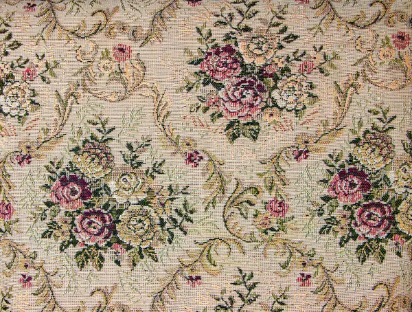 Beige fabric with floral pattern. Furniture jacquard fabric with flowers in geometric style.
