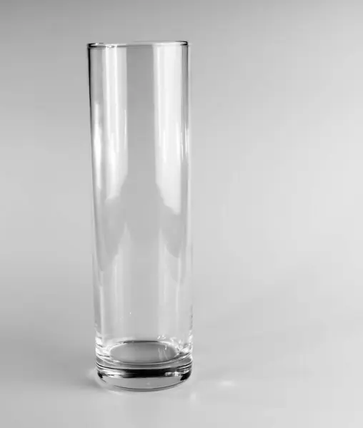 Empty crystal vase on white background. The vase was made in the mid-20th century.