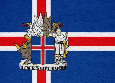 İzlanda bayrağı ve arması dokulu bir arka planda. Kavram kolajı.