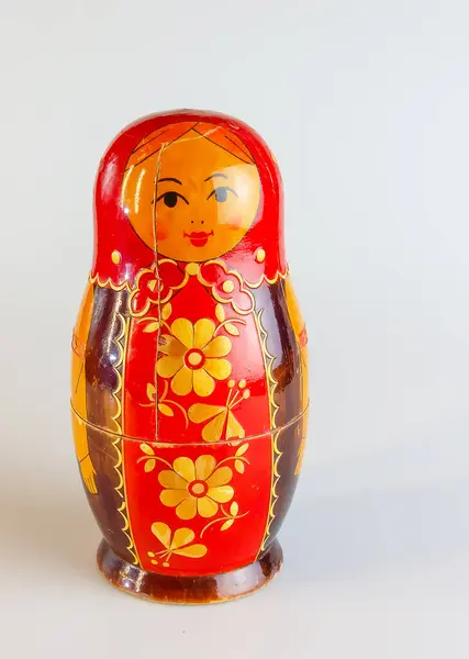 Matryoshka, a Russian wooden doll on a white background