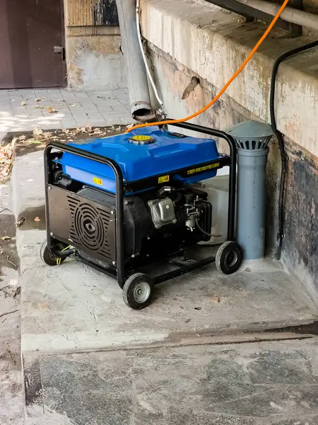 Power supply generator placed on street sidewalk. Outdoor diesel power generator in Ukraine.