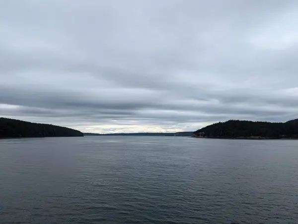 stock image Cloudy weather in Rosario Strait. View of the islands from a moving ferry. Washington State, USA.