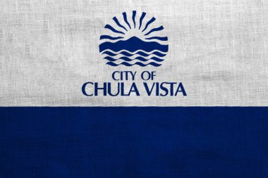 Flag of the city of Chula Vista, California, USA, on a background of fabric texture. Conceptual collage. clipart