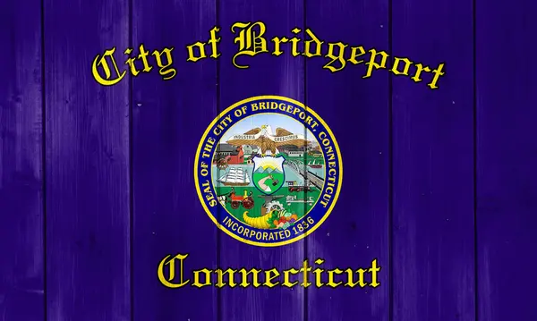 stock image Flag of the city of Bridgeport, Connecticut, USA, on a background of a wooden fence. Conceptual collage.