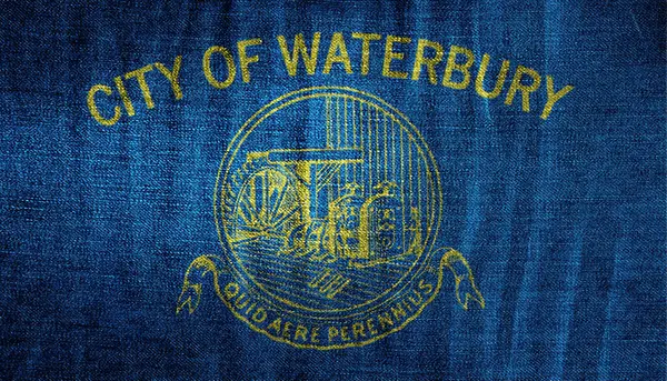 Stock image Flag of the city of Waterbury, Connecticut, USA, on a background of fabric texture. Conceptual collage.