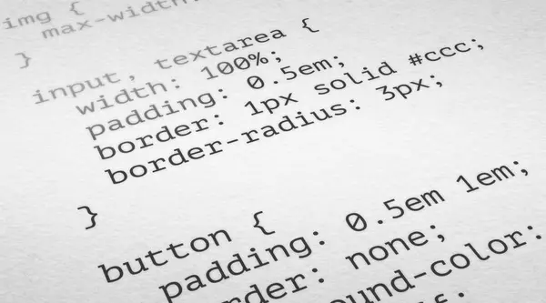 CSS code on a white paper background