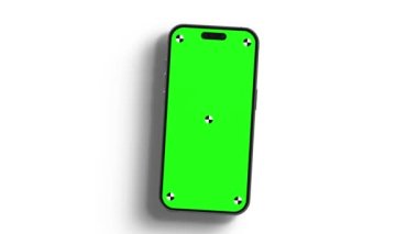 Akıllı telefonun göstergeli boş yeşil ekranı çerçeveye doğru dönüyor. Luma mat, arka plan değişikliği için dahil. Modern çerçevesiz tasarım, hareket bulanıklığı yok ve odaklanma