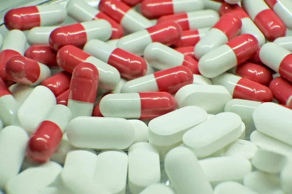 tablets . white-red tablets. close-up . the concept of health, treatment.