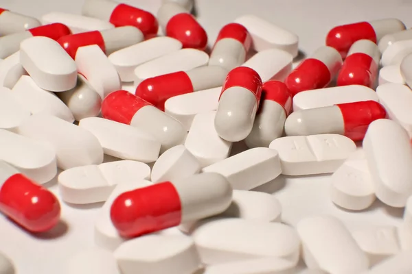 tablets . white-red tablets. close-up . the concept of health, treatment.