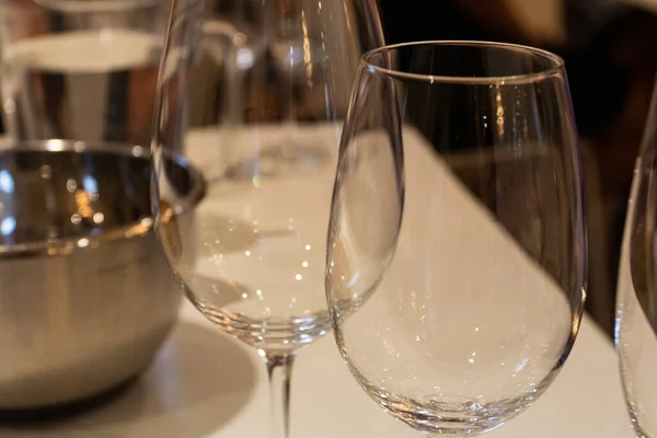 Wine glasses on a table in a restaurant, close-up