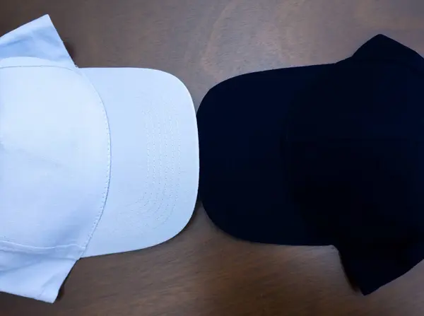 Two Headdresses Caps Different Color Dark White Baseball Cap Top — Stock Photo, Image
